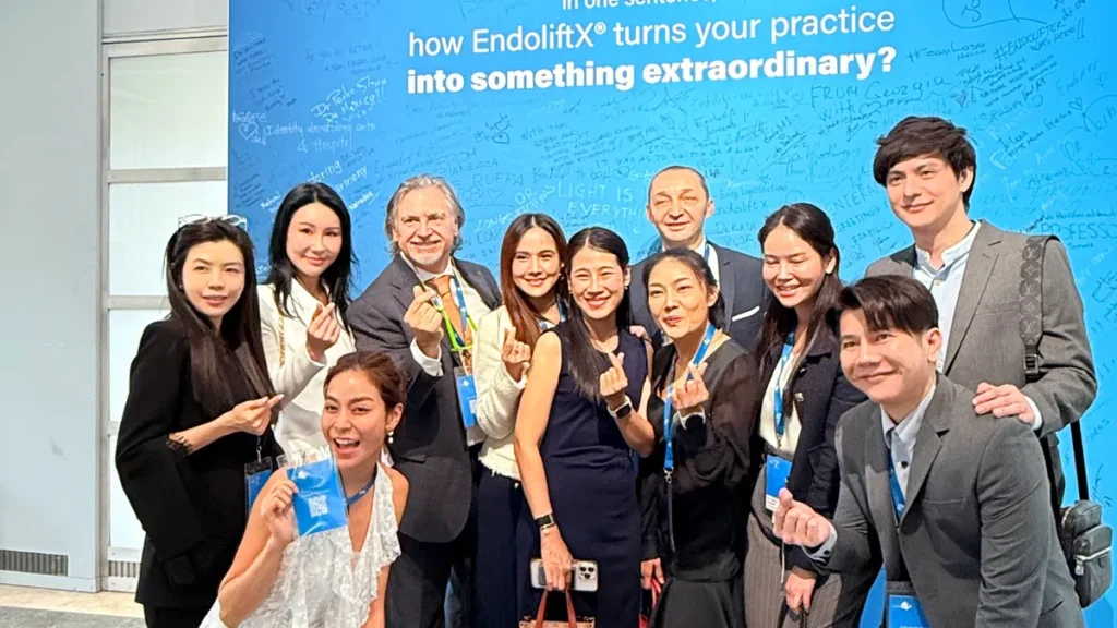 Dr. Pang Skin Clinic team with EndoliftX expert at the World EndoliftXpert Summit 2026 signature wall in Italy